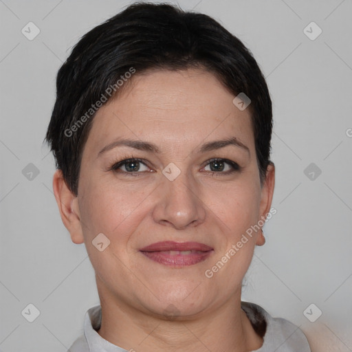 Joyful white adult female with short  brown hair and brown eyes