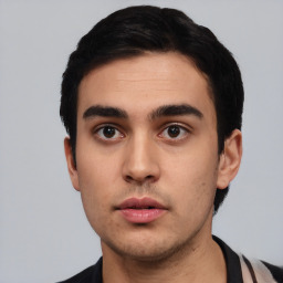 Neutral white young-adult male with short  black hair and brown eyes