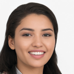 Joyful latino young-adult female with long  brown hair and brown eyes