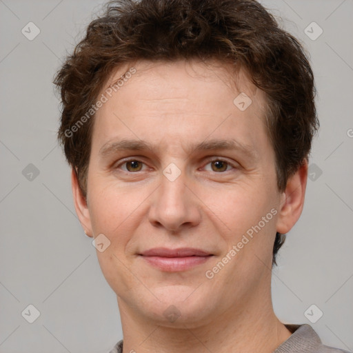 Joyful white adult male with short  brown hair and grey eyes