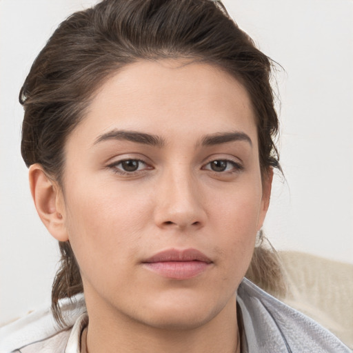 Neutral white young-adult female with medium  brown hair and brown eyes