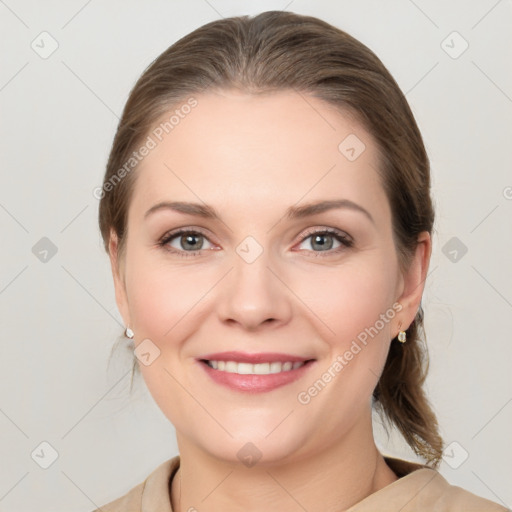 Joyful white young-adult female with medium  brown hair and grey eyes