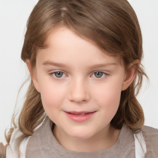 Joyful white child female with medium  brown hair and grey eyes