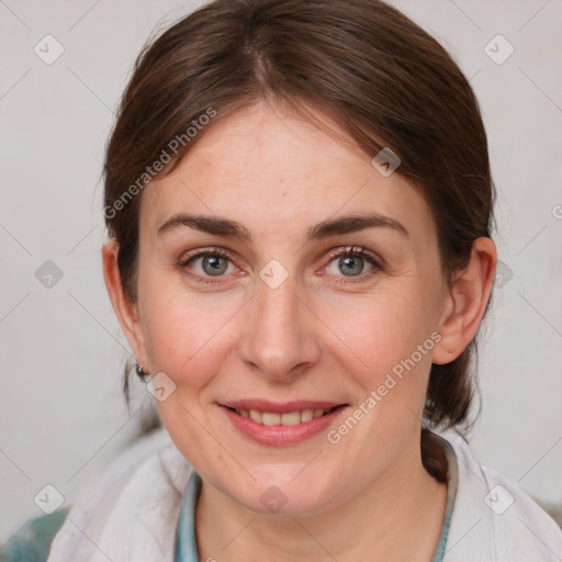 Joyful white young-adult female with medium  brown hair and blue eyes