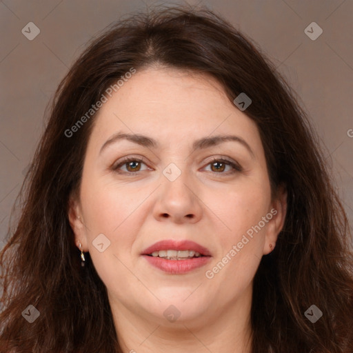 Joyful white adult female with long  brown hair and brown eyes