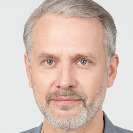 Neutral white middle-aged male with short  gray hair and brown eyes