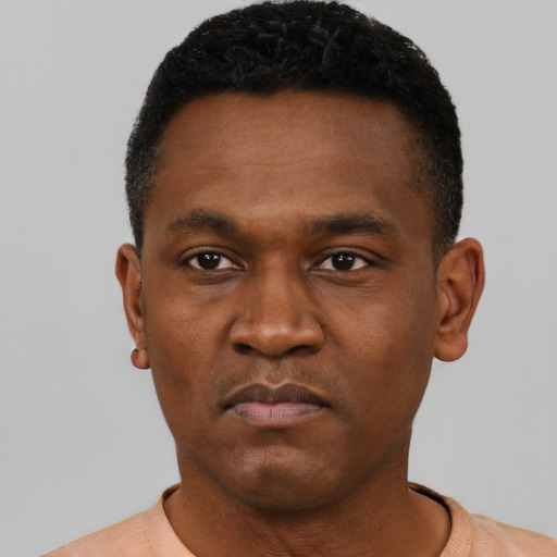 Neutral black young-adult male with short  black hair and brown eyes
