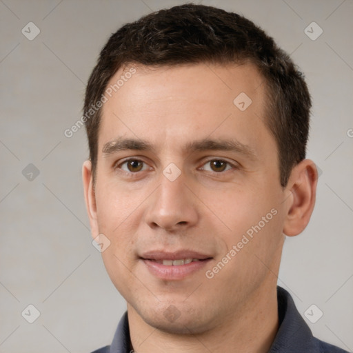 Joyful white young-adult male with short  brown hair and brown eyes