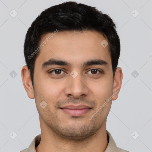 Joyful latino young-adult male with short  brown hair and brown eyes