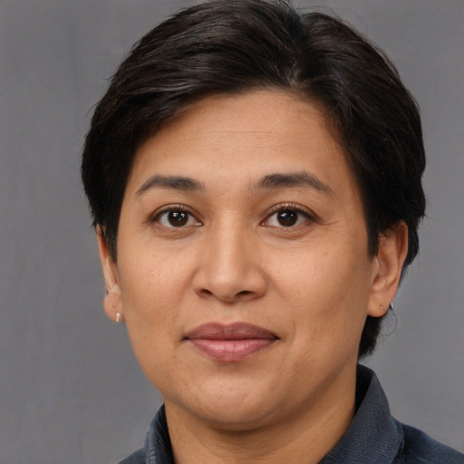 Joyful white adult female with short  brown hair and brown eyes