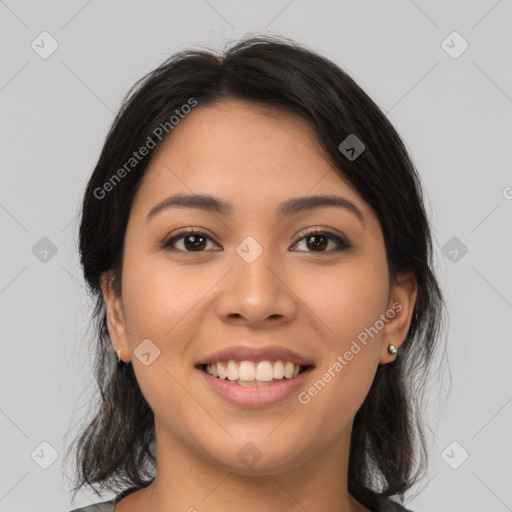 Joyful latino young-adult female with medium  brown hair and brown eyes