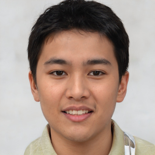 Joyful asian young-adult male with short  brown hair and brown eyes