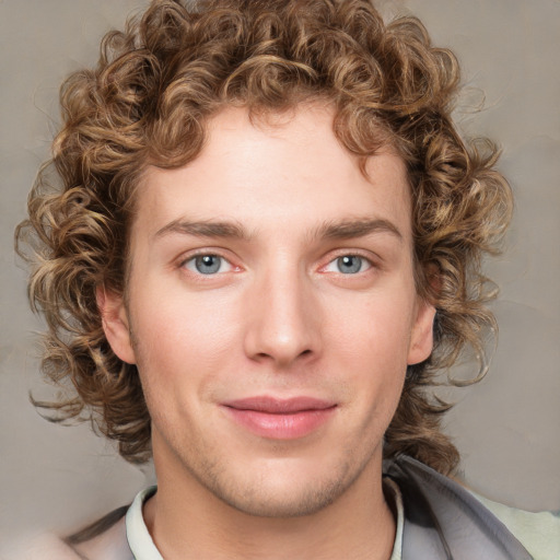 Joyful white young-adult male with medium  brown hair and grey eyes