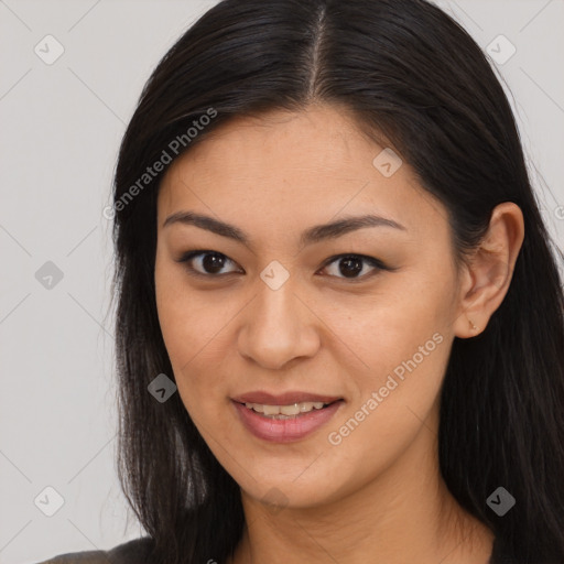 Joyful latino young-adult female with long  brown hair and brown eyes