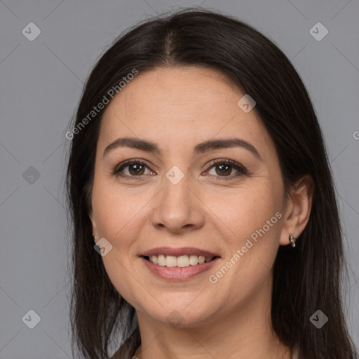 Joyful white adult female with long  brown hair and brown eyes