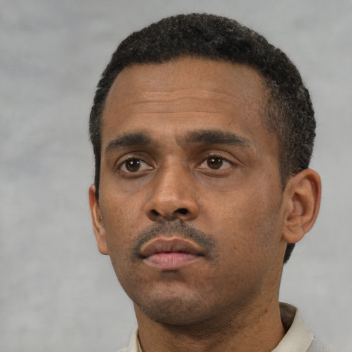 Neutral black young-adult male with short  black hair and brown eyes
