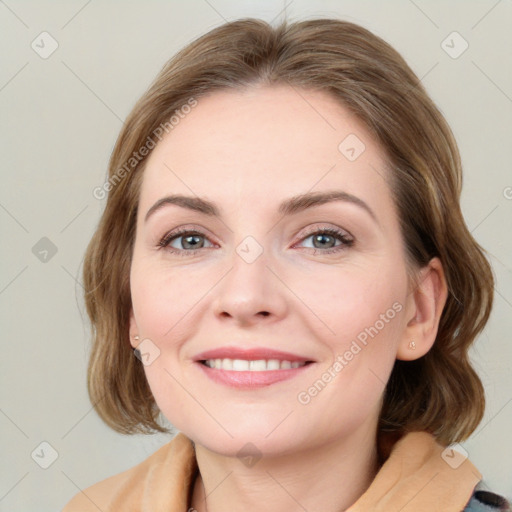 Joyful white young-adult female with medium  brown hair and blue eyes