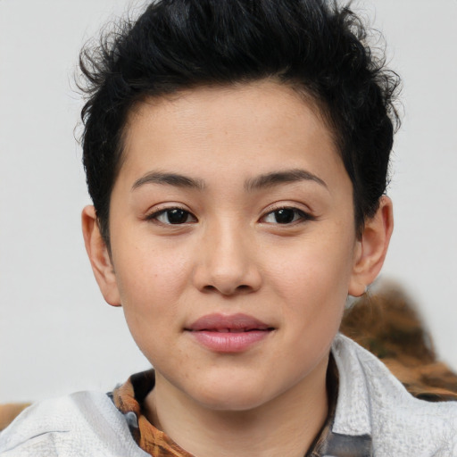 Joyful white child female with short  brown hair and brown eyes