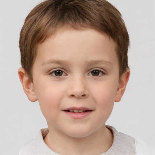 Joyful white child male with short  brown hair and brown eyes