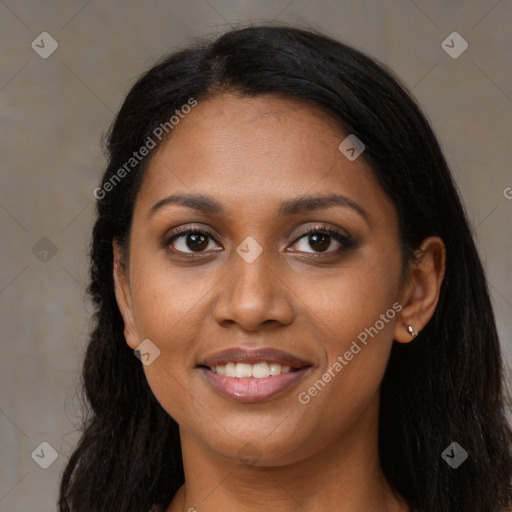 Joyful black young-adult female with long  brown hair and brown eyes