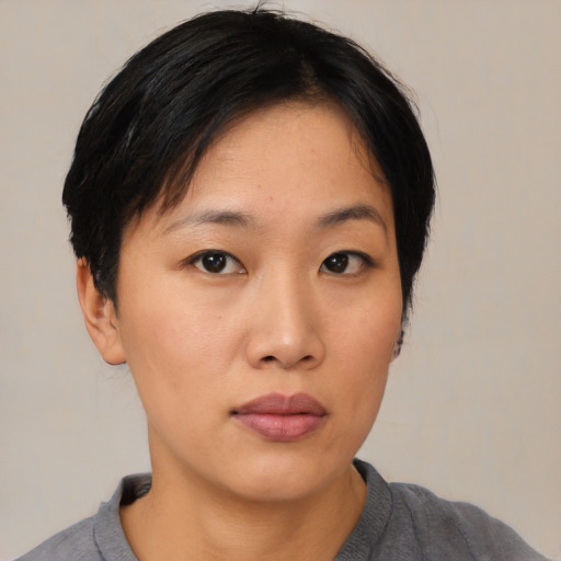 Neutral asian young-adult female with medium  black hair and brown eyes
