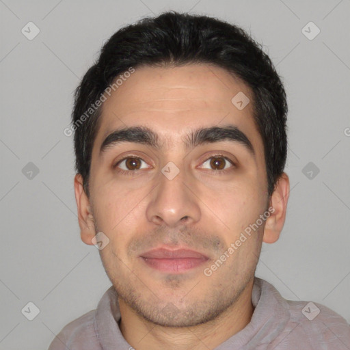 Joyful white young-adult male with short  black hair and brown eyes