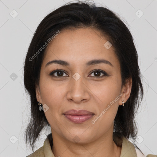 Joyful latino young-adult female with medium  brown hair and brown eyes