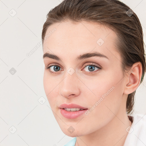 Joyful white young-adult female with medium  brown hair and blue eyes