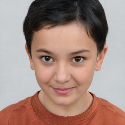 Joyful white child female with short  brown hair and brown eyes