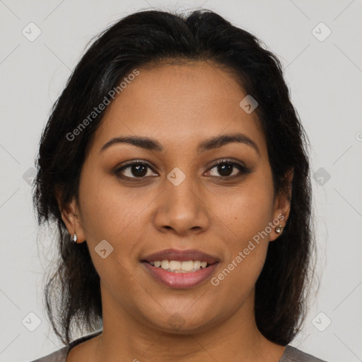 Joyful latino young-adult female with medium  brown hair and brown eyes