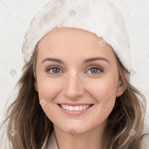 Joyful white young-adult female with long  brown hair and grey eyes