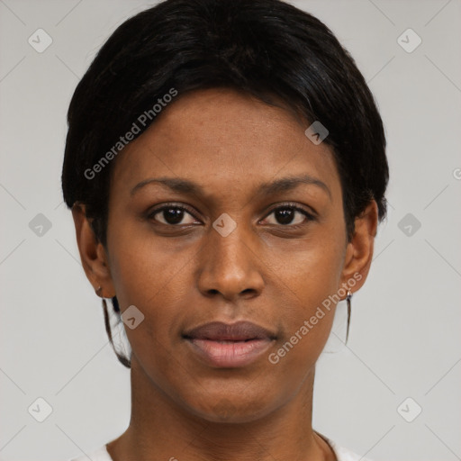 Joyful black young-adult female with short  black hair and brown eyes