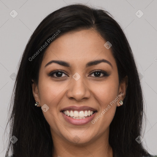 Joyful latino young-adult female with long  brown hair and brown eyes