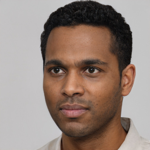 Neutral black young-adult male with short  black hair and brown eyes