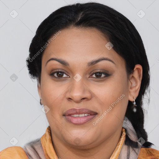 Joyful latino adult female with medium  brown hair and brown eyes