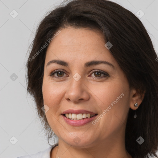 Joyful white adult female with medium  brown hair and brown eyes