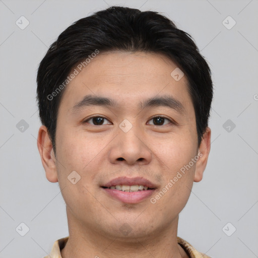 Joyful asian young-adult male with short  brown hair and brown eyes