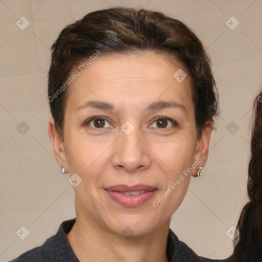 Joyful white adult female with short  brown hair and brown eyes