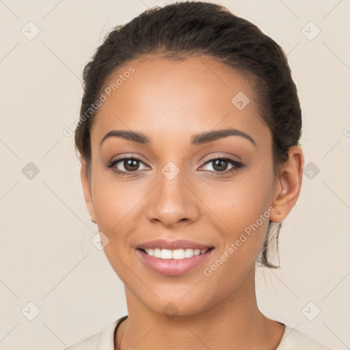 Joyful latino young-adult female with short  brown hair and brown eyes