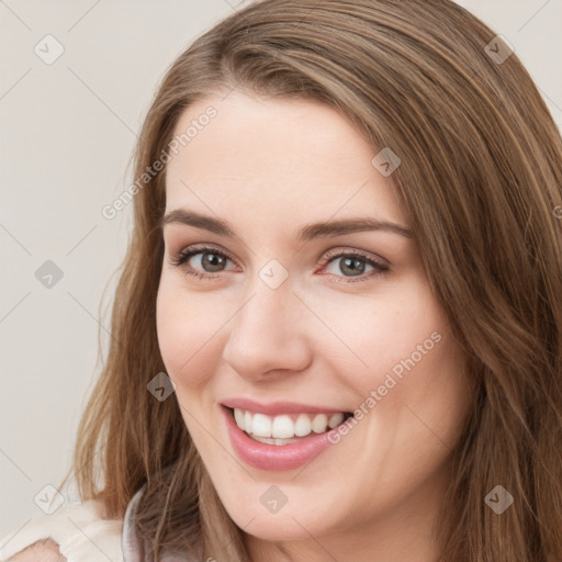 Joyful white young-adult female with long  brown hair and green eyes