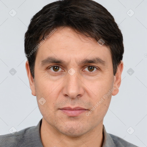 Neutral white adult male with short  brown hair and brown eyes