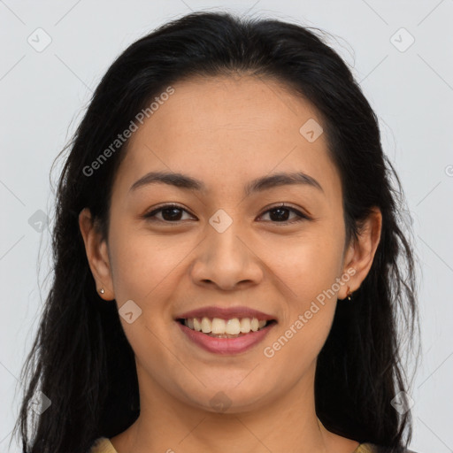 Joyful latino young-adult female with long  brown hair and brown eyes