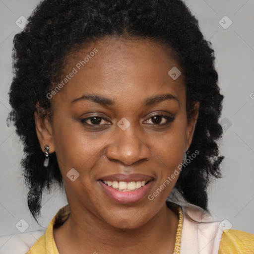 Joyful black adult female with medium  brown hair and brown eyes