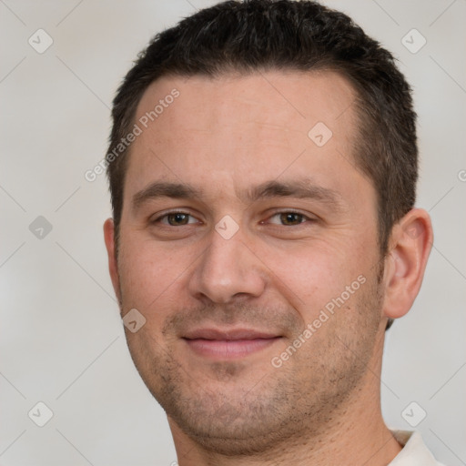 Joyful white young-adult male with short  brown hair and brown eyes