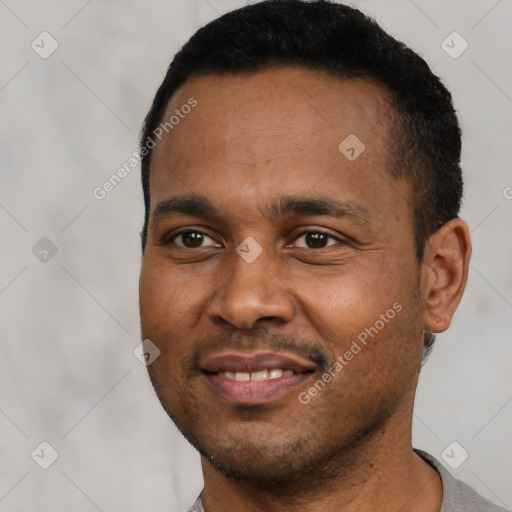 Joyful latino young-adult male with short  black hair and brown eyes