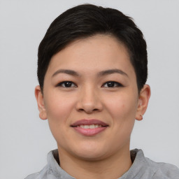 Joyful asian young-adult female with short  brown hair and brown eyes