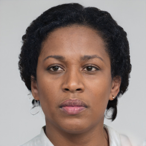 Neutral black adult female with short  brown hair and brown eyes