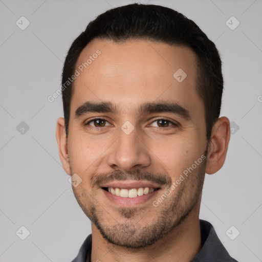 Joyful white young-adult male with short  black hair and brown eyes