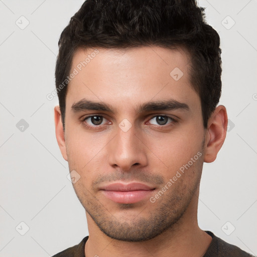 Neutral white young-adult male with short  brown hair and brown eyes