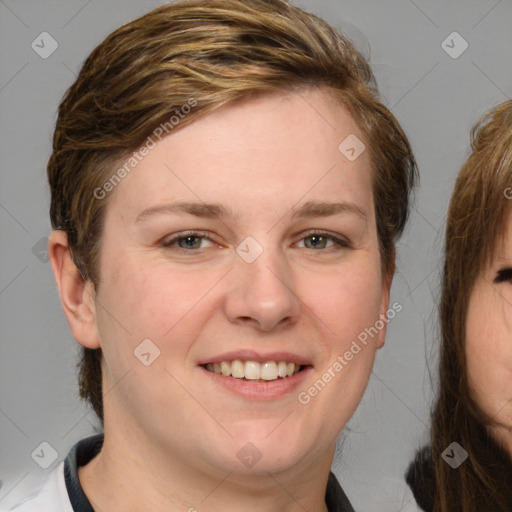 Joyful white young-adult female with medium  brown hair and blue eyes